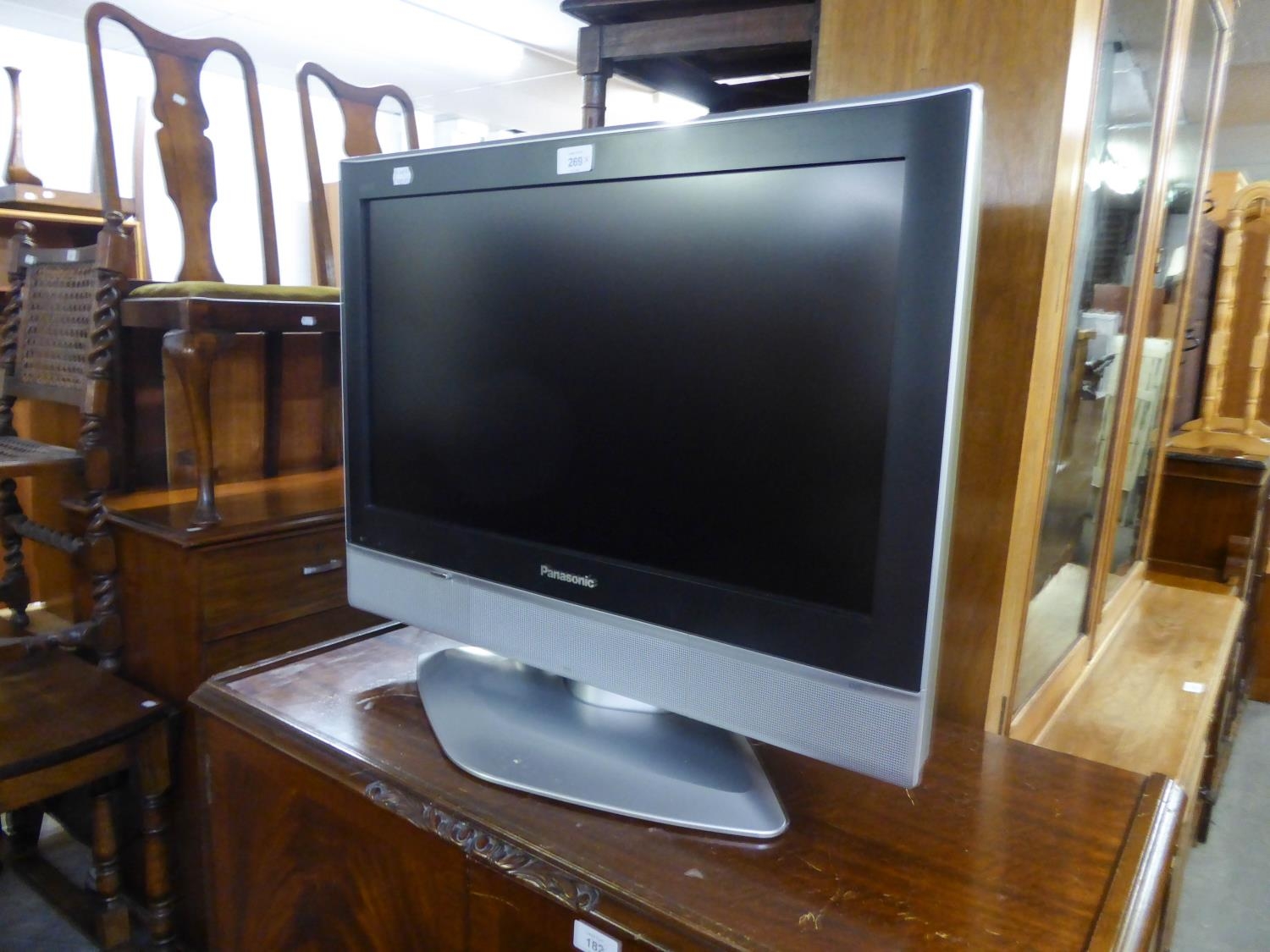 PANASONIC VIERA FLAT SCREEN TELEVISION, 25?, ON BLACK GLASS THREE-TIER STAND, WITH JVC VIDEO