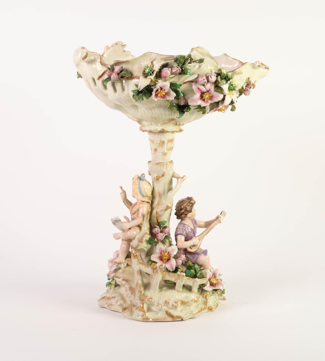 EARLY TWENTIETH CENTURY SITZENDORF, GERMAN FLORAL ENCRUSTED PORCELAIN FIGURAL PEDESTAL DISH, painted