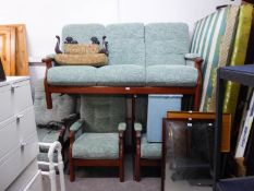 AN ELM FRAMED COTTAGE STYLE LOUNGE SUITE OF THREE PIECES, BUTTON UPHOLSTERED IN GREEN LEAF PATTERN