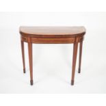 REGENCY MAHOGANY AND SATINWOOD CROSSBANDED CARD TABLE, the fold-over D shaped top enclosing a