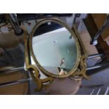 A TRIPLE OVAL TOILET MIRROR