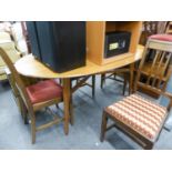 A PALE WALNUT OVAL DINING TABLE, WITH FIXED TOP, ON FOUR SLIGHTLY SPLAYED TAPERING LEGS, 5?6?