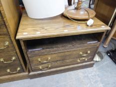 AN ELM TELEVISION STAND WITH OPEN COMPARTMENT AND TWO DRAWERS BELOW WITH BRASS DROP HANDLES, ON