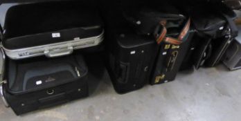 FOUR VARIOUS SUITCASES, THREE BRIEFCASES AND TWO HOLDALLS (9)