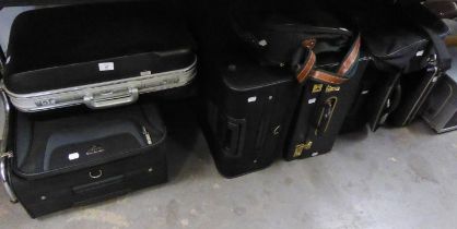 FOUR VARIOUS SUITCASES, THREE BRIEFCASES AND TWO HOLDALLS (9)