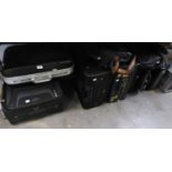 FOUR VARIOUS SUITCASES, THREE BRIEFCASES AND TWO HOLDALLS (9)