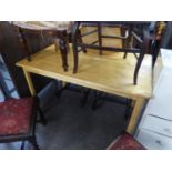 A BLOND BEECH WOOD OBLONG KITCHEN TABLE AND A BUTLERS TRAY WITH FOLDING STAND  (2)