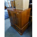 CHARLES BARR, CHERRY AND FIGURED MAHOGANY GEORGIAN STYLE TWO DOOR TELEVISIONS CABINET WITH FALL