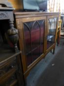 A LARGE INLAID MAHOGANY TWO DOOR BOOKCASE/DISPLAY CABINET, WITH BEAD DECORATION TO GLAZED DOORS,