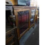 A LARGE INLAID MAHOGANY TWO DOOR BOOKCASE/DISPLAY CABINET, WITH BEAD DECORATION TO GLAZED DOORS,