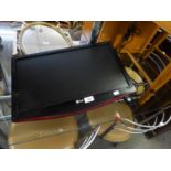 A L.G. FLAT SCREEN 21" TELEVISION WITH WALL BRACKET