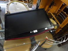 A L.G. FLAT SCREEN 21" TELEVISION WITH WALL BRACKET