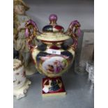 VIENNA STYLE POTTERY TWO HANDLED URN SHAPED VASE AND DOMED COVER, PRINTED IN A RESERVE WITH