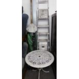 A LIGHTWEIGHT ORNATE METAL GARDEN TABLE, A LARGE SET OF ALUMINIUM STEP LADDERS, A SMALLER SET AND