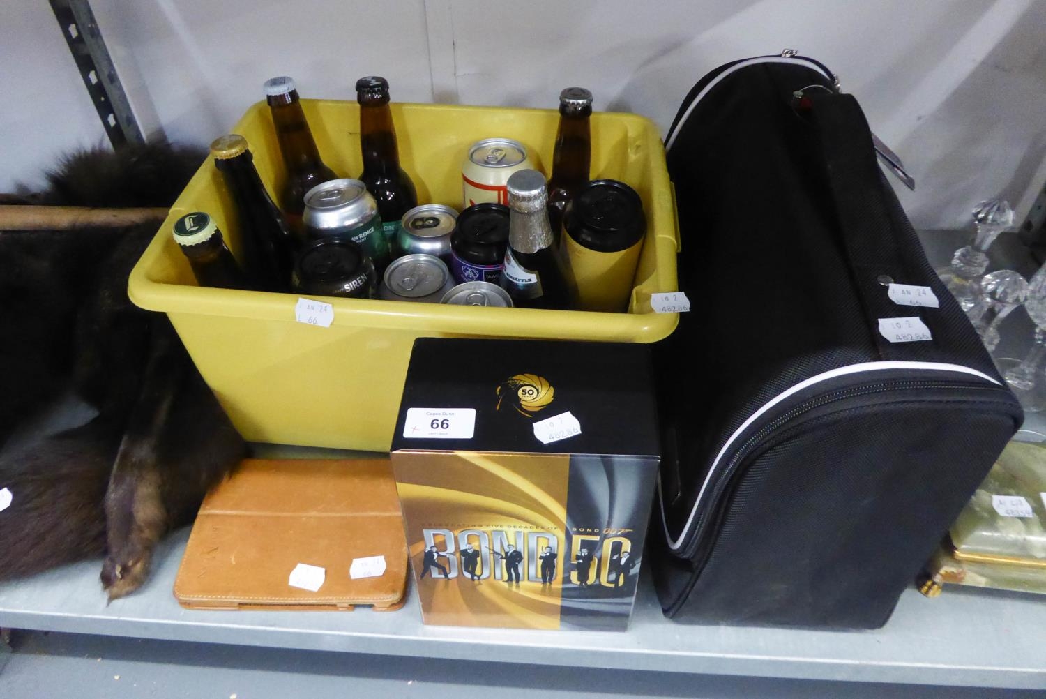 A BOXED SET OF JAMES BOND DVDS; SIXTEEN BOTTLES OR CANS OF CRAFT BEER; A LIFE SHIRE CANVAS HOLDALL