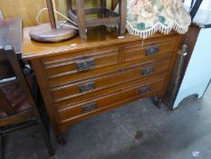 EDWARDIAN WALNUT BEDROOM CHEST OF TWO SHORT AND TWO LONG DRAWERS, ON TURNED TAPERING LEGS WITH BRASS