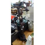 A BRONZED METAL NUDE FEMALE FIGURE TABLE LAMP, WITH FOLIATE POTTERY TOP, WITH FROSTED GLASS FLORAL