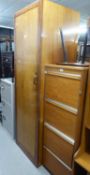 A TALL NARROW LINEN CUPBOARD AND A WOODEN FILE RACK (2)