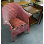 A PINK LLOYD LOOM TUB SHAPED ARMCHAIR AND A WALNUT TWO TIER TV TROLLEY (2)