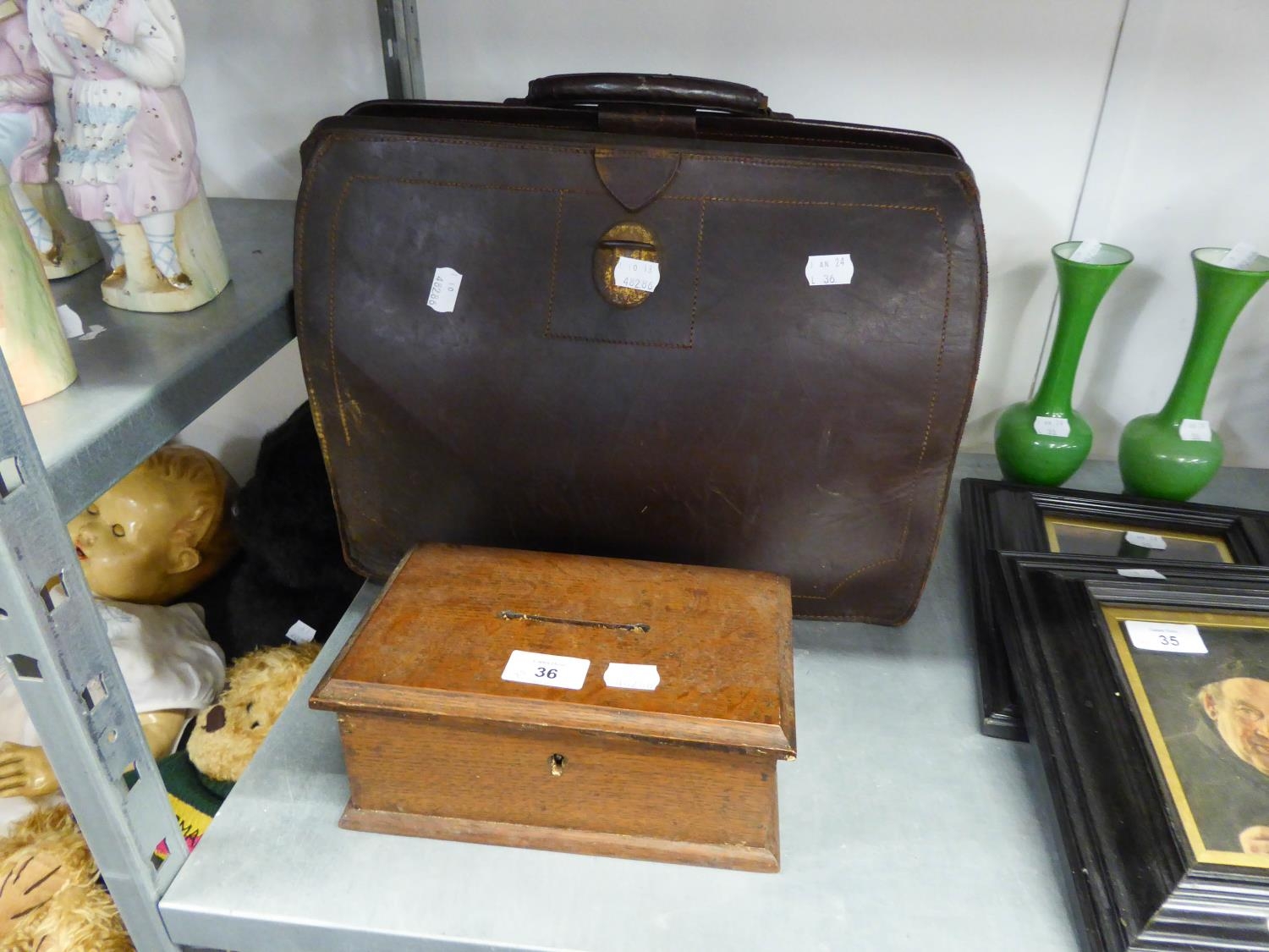 A BROWN LEATHER ATTACHÉ CASE AND AN OAK OBLONG MONEY BOX (2)