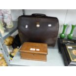 A BROWN LEATHER ATTACHÉ CASE AND AN OAK OBLONG MONEY BOX (2)