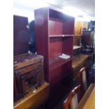 A WOOD-EFFECT SIX TIER OPEN BOOKCASE