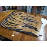 MODERN BROWN LARGE COW HIDE RUG, overprinted in black with a zebra pattern, 100? x 77?