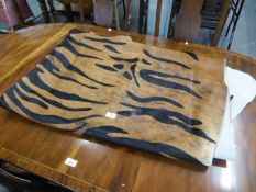 MODERN BROWN LARGE COW HIDE RUG, overprinted in black with a zebra pattern, 100? x 77?