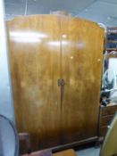A WALNUTWOOD TWO DOOR WARDROBE; AN OAK MILLINERY CABINET, WITH TWO DOORS OVER TWO DRAWERS AND