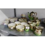 ORIENTAL EGGSHELL CHINA- FIFTEEN PIECE COFFEE SET, IN GREEN AND BLACK, SET OF FIVE TEACUPS AND
