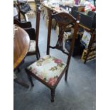 A SET OF FOUR EDWARDIAN CARVED MAHOGANY SINGLE CHAIRS, WITH PIERCED SPLAT BACKS