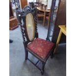 A SET OF FOUR OAK DINING CHAIRS, WITH CANE DECORATION TO THE BACKS, RAISED ON BARLEY TWIST FRONT