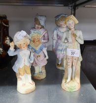 FIVE MODERN TINTED BISQUE FIGURES, including two pairs, unmarked, 9? (22.9cm) high and smaller, (