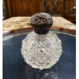 EDWARDIAN CUT GLASS GLOBULAR PERFUME BOTTLE WITH SCROLL EMBOSSED SILVER SCREW-OFF TOP, BIRMINGHAM