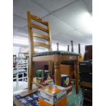 A PAIR OF PINE LADDER BACK KITCHEN CHAIRS, HAVING PADDED SEATS (2)