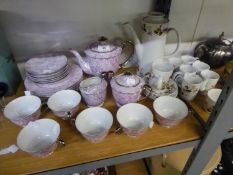 A STYLISH PORCELAIN TEASET FOR SIX PERSONS, DECORATED IN LILAC DOTS AND A COFFEE SET FOR SIX PERSONS