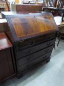 A REPRODUCTION MAHOGANY BUREAU FALL FRONT OVER FOUR DRAWERS (A.F.)
