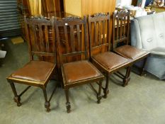 A SET OF FOUR EARLY 20TH CENTURY CARVED OAK SINGLE DINING CHAIRS, WITH RAIL AND SPLAT BACKS, DROP-IN