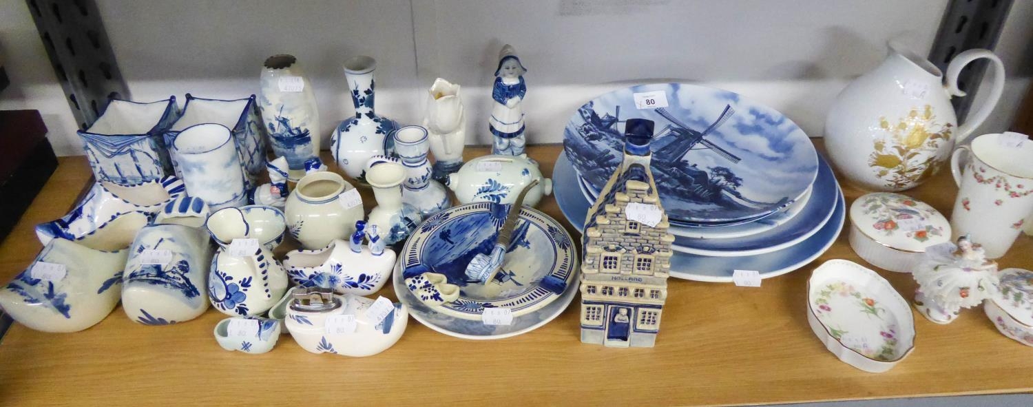 A GOOD SELECTION OF DELFT 'HOLLAND' ITEMS TO INCLUDE; A SHOP, CLOGS, VASES, MONEY BOX, TABLE