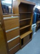 A WOOD EFFECT OPEN BOOKCASE WITH CUPBOARDS BELOW AND A CAPLAN TEAK FOUR DRAWER FILING CABINET (2)