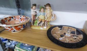 A BRETBY ART POTTERY JAPANESQUE WALL PLAQUE, A GERMAN BISQUE PORCELAIN FIGURAL GROUP AND AN EARLY