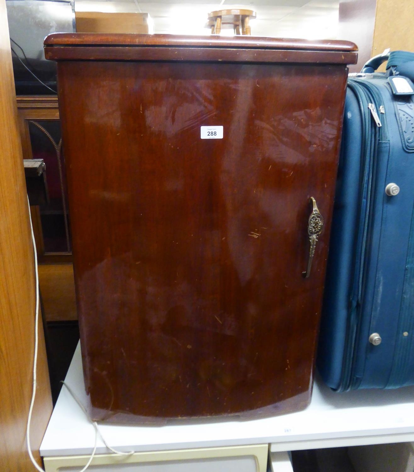 AN ELECTRIC DROP-HEAD SEWING MACHINE IN WALNUT CABINET CASE