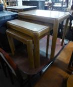 A NEST OF THREE TEAK OBLONG COFFEE TABLES