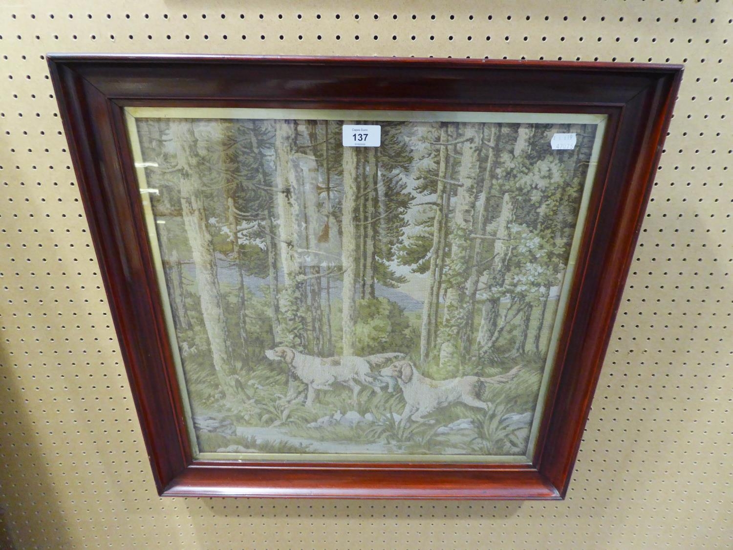 A MACHINE WOVEN TAPESTRY OF DOGS WALKING IN A WOODLAND NEAR A STREAM