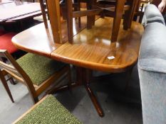 A MODERN MAHOGANY BREAKFAST TABLE, ON COLUMN AND QUARTETTE BASE