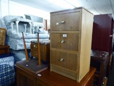 AN OAK BEDSIDE CHEST OF THREE DRAWERS, 1960S OBLONG COFFEE TABLE AND A FOOTSTOOL/WORK BOX WITH TWO