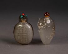 CHINESE OVULAR ROCK CRYSTAL SNUFF BOTTLE AND STOPPER, carved in bas relief with a monkey clinging on