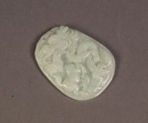 CHINESE WHITE JADE OVULAR PENDANT, carved in bas relief with a dragon attacking a horse, flat