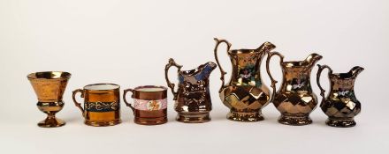 SEVEN PIECES OF VICTORIAN COPPER LUSTRE POTTERY, comprising: GRADUATED SET OF THREE JUGS, ANOTHER,