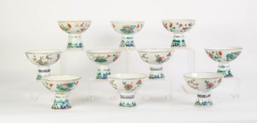 SUITE OF NINE CHINESE ENAMELLED PORCELAIN STEM BOWLS, each decorated in rose pink, blue/green,